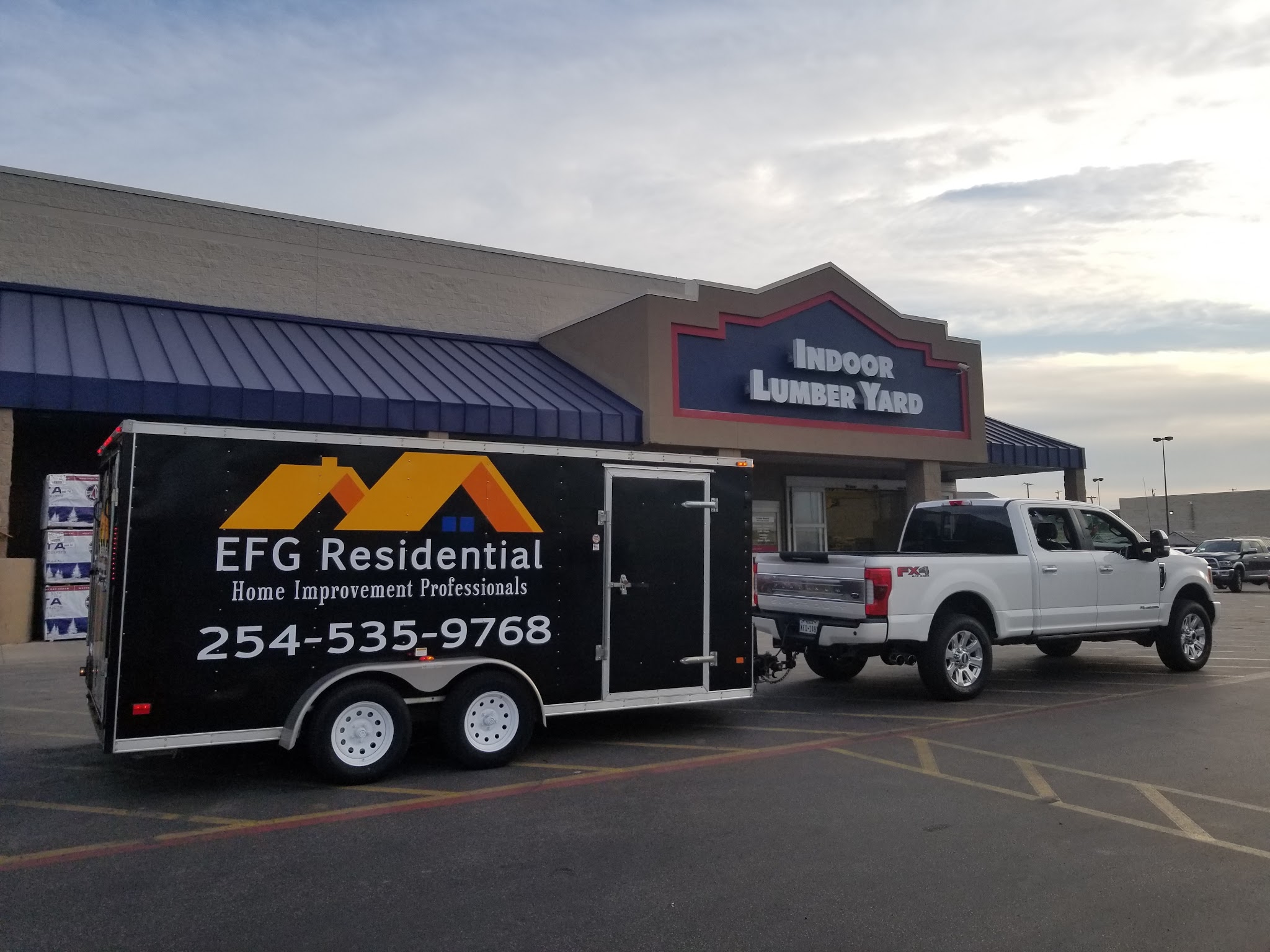EFG branded truck and trailer at job site